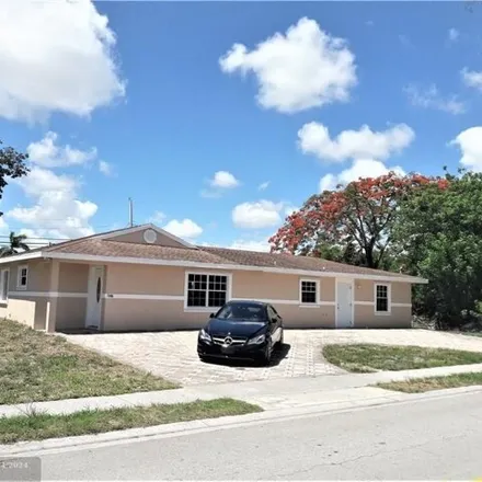 Rent this 4 bed house on 2620 Oswego Avenue in Westgate-Belvedere Homes, Palm Beach County
