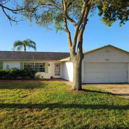 Rent this 3 bed house on 1913 Tallpalm Road in Melbourne, FL 32935