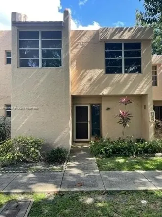 Rent this 3 bed townhouse on 9421 Live Oak Pl Apt 102 in Davie, Florida