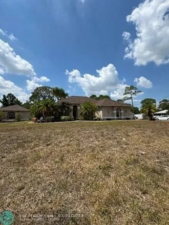 Buy this 4 bed house on 18190 46th Ct N in Loxahatchee, Florida