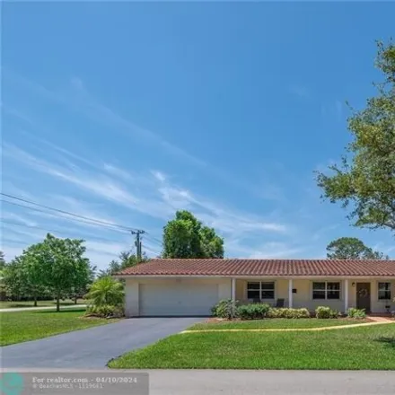Rent this 3 bed house on 8506 Hampshire Drive in Coral Springs, FL 33065