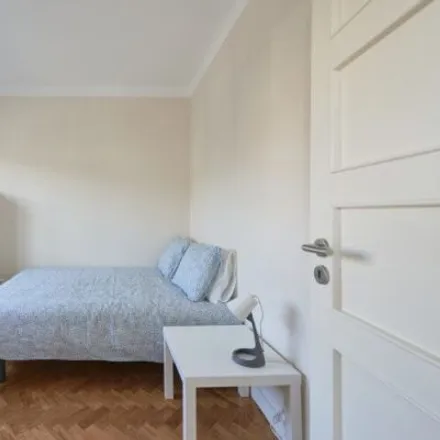 Rent this 4 bed room on Rua Carlos Malheiro Dias 10 in 1700-108 Lisbon, Portugal