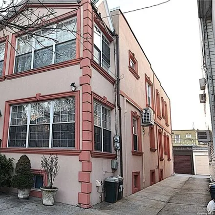 Buy this 7 bed house on 78-34 73rd Place in New York, NY 11385