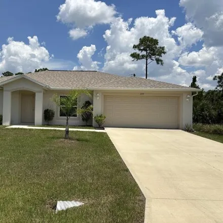 Buy this 4 bed house on 337 Alamo Street Southeast in Palm Bay, FL 32909