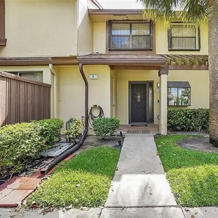 Buy this 3 bed townhouse on 3032 Cocoplum Circle in Coconut Creek, FL 33063