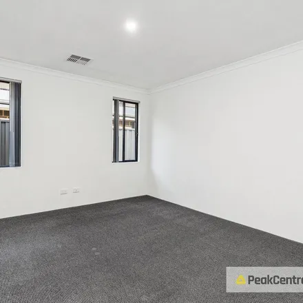 Rent this 4 bed apartment on 9 Lapis Road in Treeby WA 6164, Australia