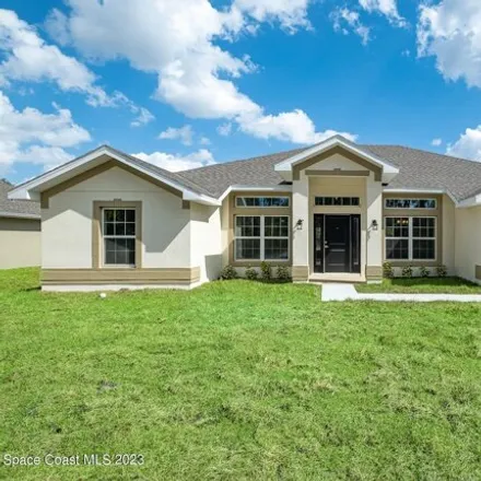 Buy this 4 bed house on 3044 Toulon Road Southeast in Palm Bay, FL 32909