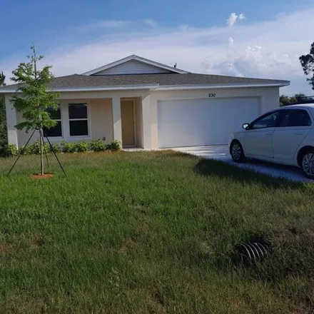Rent this 3 bed house on 230 Prairie St SE in Palm Bay, Florida