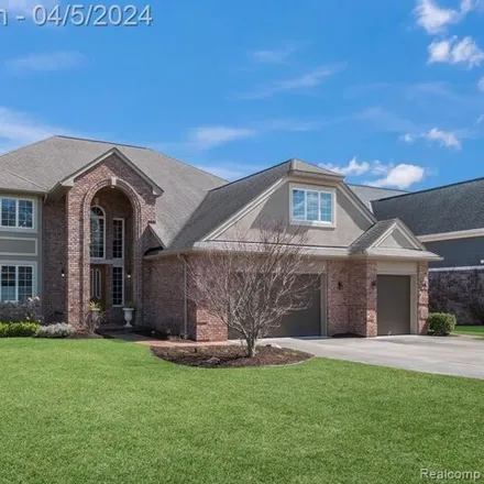 Buy this 4 bed house on 4852 Driftwood Drive in Commerce Charter Township, MI 48382