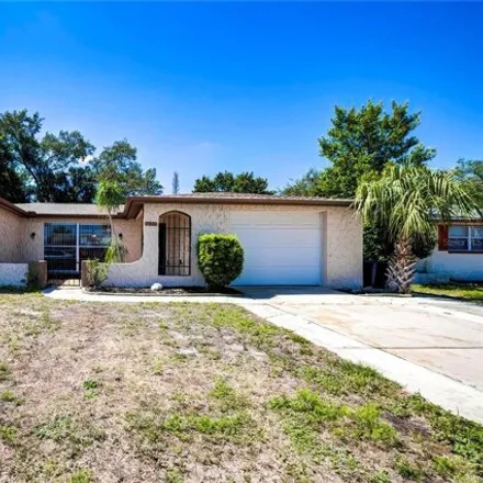 Buy this 3 bed house on 7334 Brentwood Drive in Jasmine Estates, FL 34668