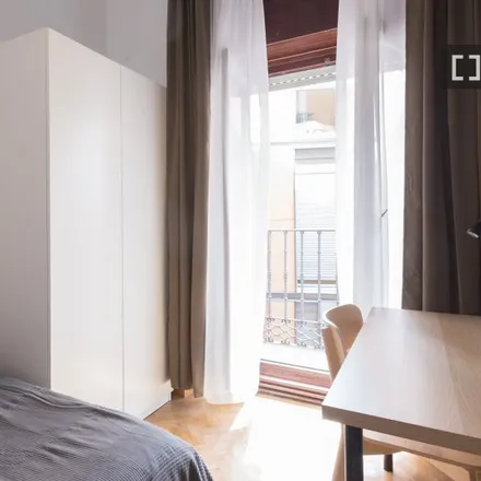 Rent this 6 bed room on Plaza de Herradores in 8, 28013 Madrid