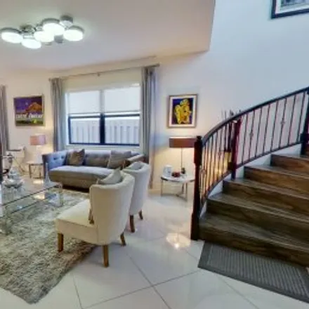 Buy this 5 bed apartment on 9925 Northwest 89Th Ter in Doral Breeze, Doral