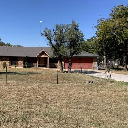 Rent this 4 bed house on 990 J E Woody Road in Springtown, Parker County