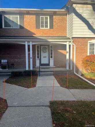 Buy this 2 bed townhouse on 20649 Williamsburg Court in Harper Woods, MI 48225