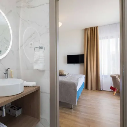 Rent this 4 bed apartment on 21312 Općina Podstrana