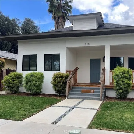 Rent this 4 bed house on 316 East Clark Street in Redlands, CA 92373