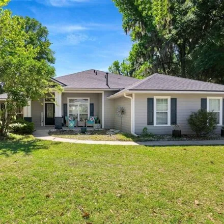 Buy this 4 bed house on 11590 Creek Drive in Alachua, FL 32615