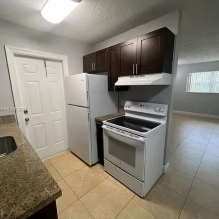 Rent this 2 bed house on 553 Northeast 38th Court in Tedder, Deerfield Beach