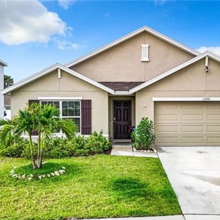 Buy this 4 bed house on Golden Lime Avenue in Spring Hill, FL 34609