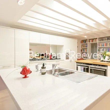 Rent this 5 bed townhouse on The Coach House in 12 Millfield Lane, London