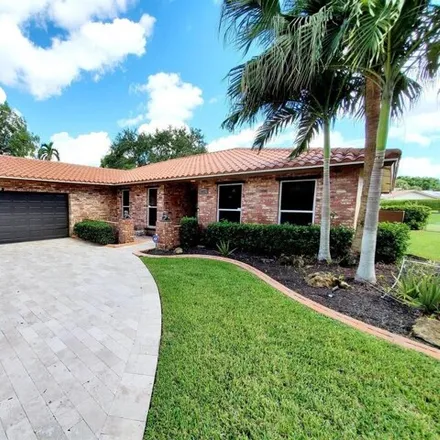 Buy this 4 bed house on 10027 Ramblewood Drive in Coral Springs, FL 33071