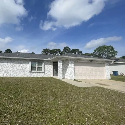 Rent this 3 bed house on 872 Altura Avenue Southeast in Palm Bay, FL 32909