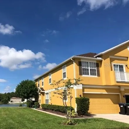 Rent this 3 bed townhouse on 10816 Derringer Drive in Orange County, FL 32829