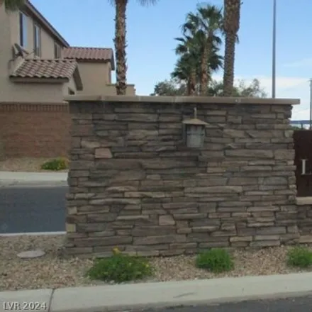 Rent this 4 bed house on 7175 Flowering Rose Avenue in Spring Valley, NV 89117