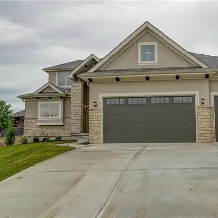 Buy this 4 bed house on 1001 Northeast Whispering Winds Circle in Lee's Summit, MO 64064