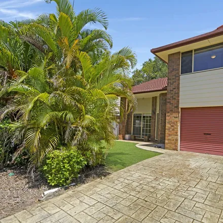 Rent this 3 bed townhouse on Pizza Hut Boonooroo Park in 2 Coelia Court, Carrara QLD 4211