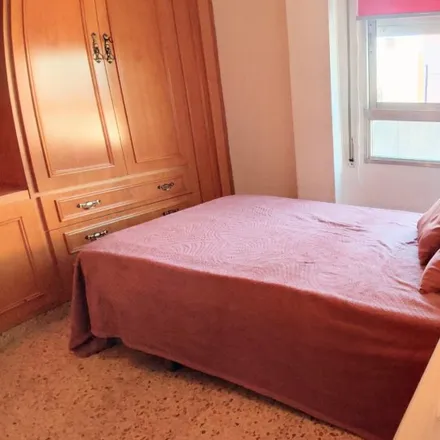 Rent this 4 bed room on Calle de Micer Mascó in 46100 Burjassot, Spain