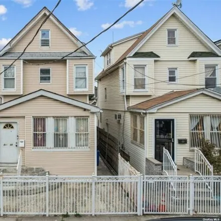 Buy this 5 bed house on 145-11 106th Avenue in New York, NY 11435