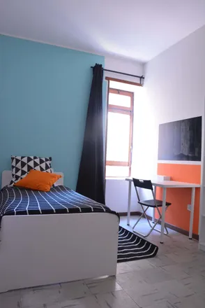 Rent this 6 bed room on Via Tigellio 20a in 09123 Cagliari Casteddu/Cagliari, Italy
