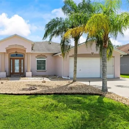 Buy this 3 bed house on Grand Club Cypress Course in Evansmill Place, Palm Coast