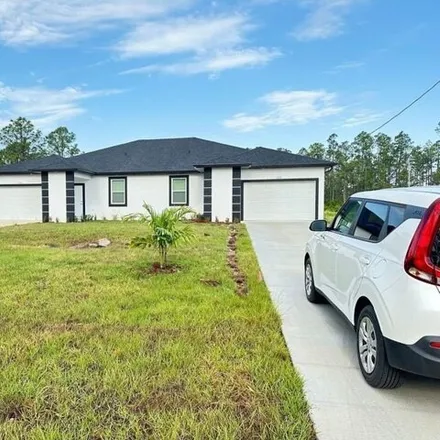 Rent this 3 bed house on 527 Bell Boulevard in Lehigh Acres, FL 33974