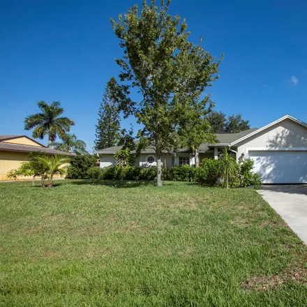 Buy this 3 bed house on 2409 Southwest Falcon Circle in Port Saint Lucie, FL 34953