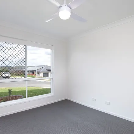 Rent this 4 bed apartment on 53 Danbulla Street in South Ripley QLD 4306, Australia