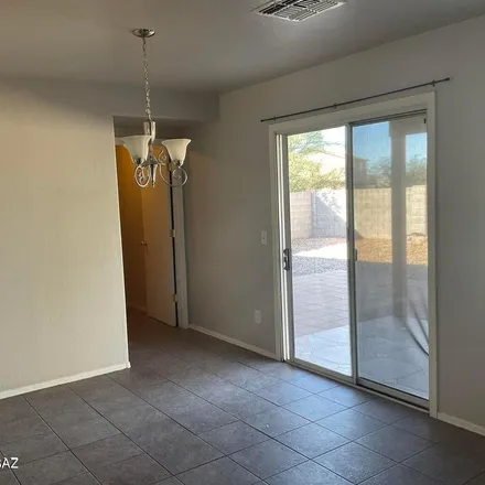 Rent this 3 bed apartment on 5899 East Fantail Lane in Tucson, AZ 85756