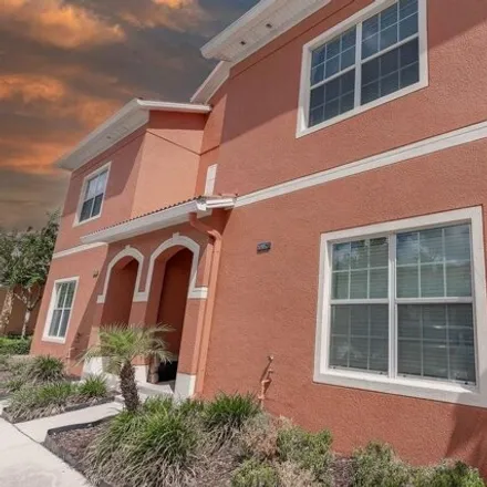 Rent this 4 bed townhouse on 8957 Bismarck Palm Rd in Kissimmee, Florida