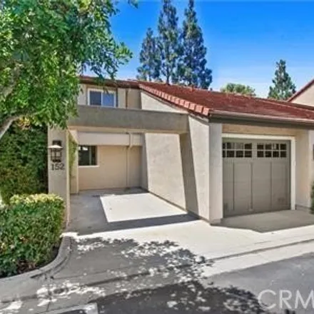 Rent this 3 bed townhouse on 152 Stanford Ct Unit 76 in Irvine, California