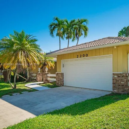 Buy this 4 bed house on 2200 Northwest 41st Terrace in Coconut Creek, FL 33066
