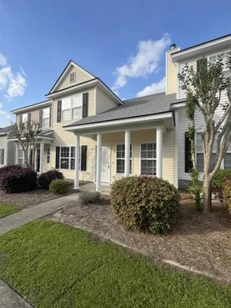 Rent this 3 bed townhouse on 152 Lynches River Drive in Chandler Lakes, Summerville