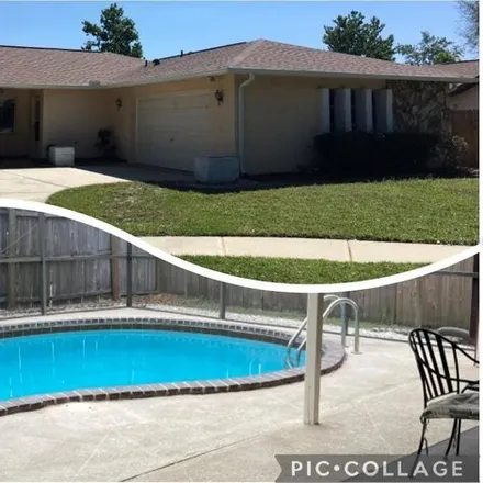 Rent this 3 bed house on 3192 Evewood Court in Elfers, FL 34690