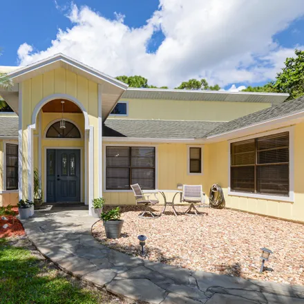 Buy this 4 bed house on 2450 Southwest Maplewood Drive in Palm City, FL 34990
