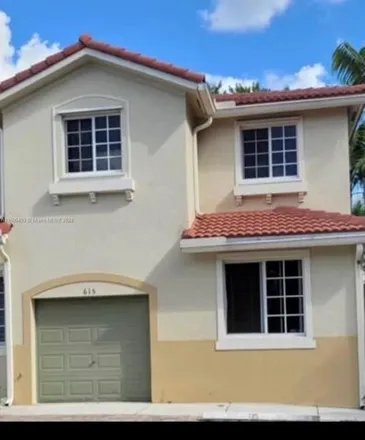 Buy this 4 bed townhouse on 21429 NW 13th Ct Apt 615 in Miami Gardens, Florida