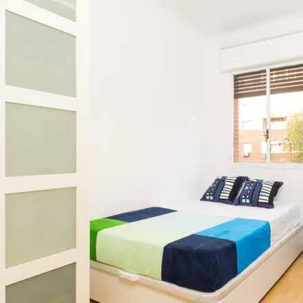 Rent this 6 bed room on Calle de Pedro Unanue in 28045 Madrid, Spain