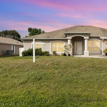 Buy this 4 bed house on 1070 Dusseldorf Avenue Northwest in Palm Bay, FL 32907