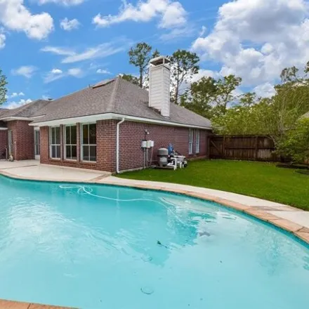 Rent this 4 bed house on Almond Brook Lane in Houston, TX 77062