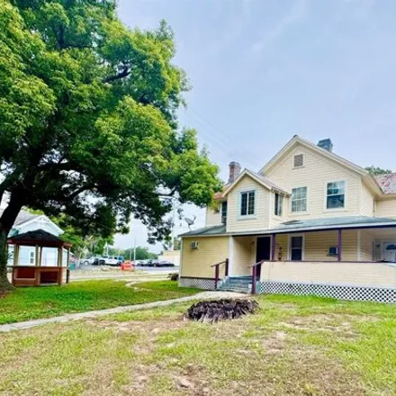 Buy this 5 bed house on 105 S Grove St in Eustis, Florida