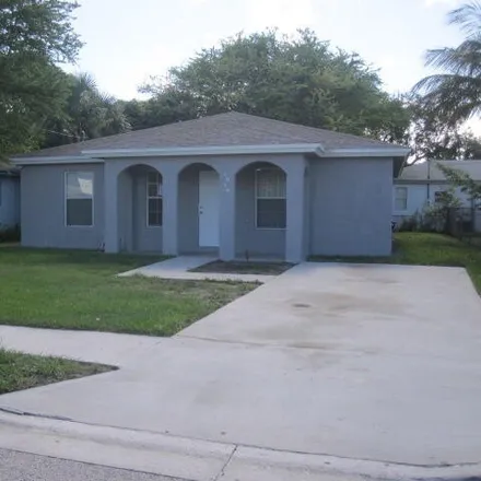 Rent this 4 bed house on 1080 Windsor Avenue in West Palm Beach, FL 33401